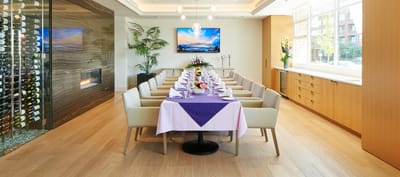 Elegant dining room setup with flowers and wine storage