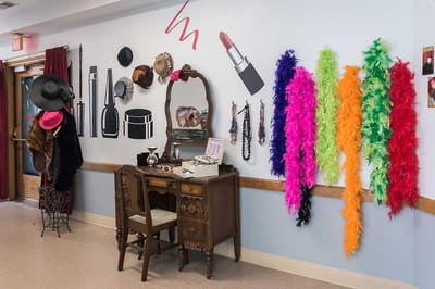 Decorative activity wall in a common area with costumes