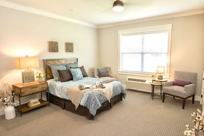 Bright and airy private resident bedroom with a cozy setup