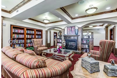 Comfortable common area with bookshelves and seating