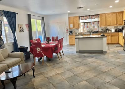 Bright common area with kitchen and dining space