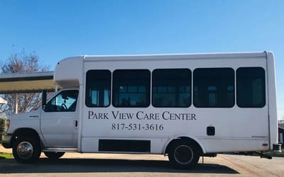 Facility transport vehicle with logo and contact information