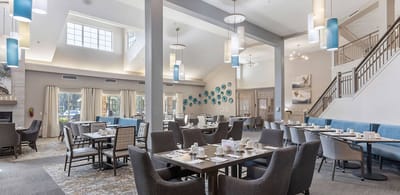 Bright and welcoming dining room with set tables