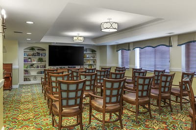 Interior common area with seating and bookshelf
