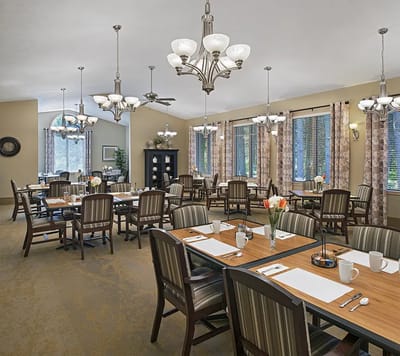 Dining room setup with tables and chairs