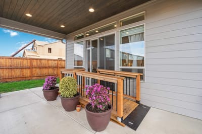 Patio area with flowers and a ramp