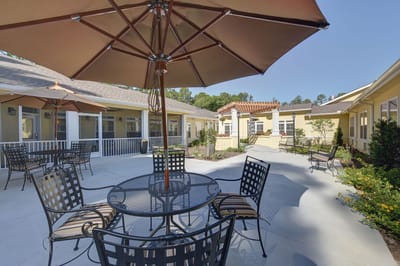 Outdoor patio area with tables and umbrellas