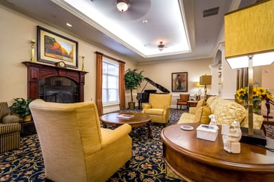 Cozy common area with seating and piano
