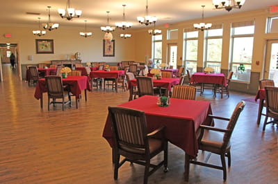 Bright dining room with tables set for meals