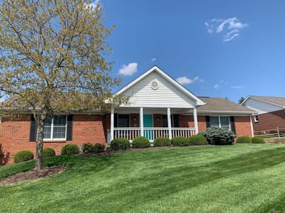 Exterior view of a senior living facility with landscaping