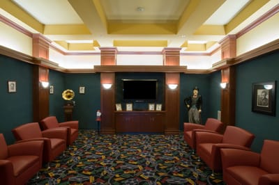 Interior view of a common area with red chairs