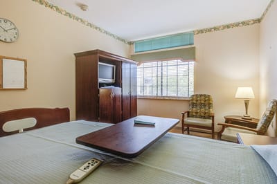 Well-furnished resident room with a window