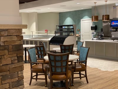 Interior dining area with seating and food counter