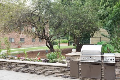 White Oak of Columbia, Nursing Home in Columbia, SC — Outdoor space with a barbeque and garden area