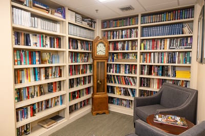 Cozy reading nook with bookshelves and armchair