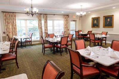 Elegant dining room setup with tables and chairs