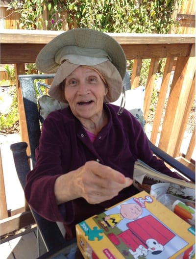 Elderly woman enjoying outdoor time with a game
