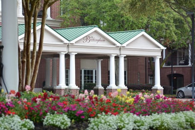 Exterior view of The Buckingham with flowers in foreground
