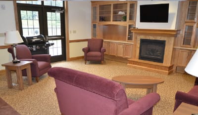 Common area with seating and fireplace