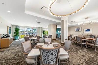 Bright dining area with modern furniture and artwork