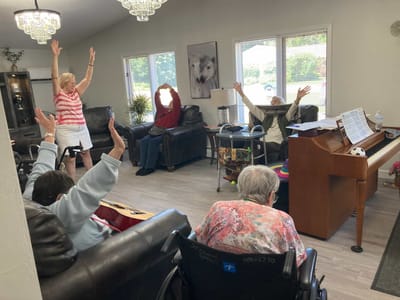Residents enjoying a music activity in a common area