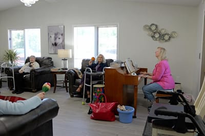 Residents participating in a music activity in common area