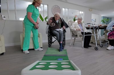 Residents participating in a recreational activity indoors