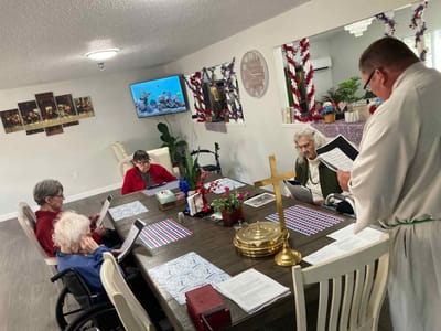Residents participating in a group activity in the common area