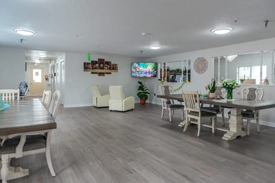 Bright common area with seating and a television