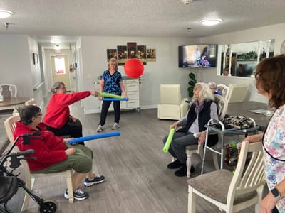 Residents participating in an engaging activity in the common area