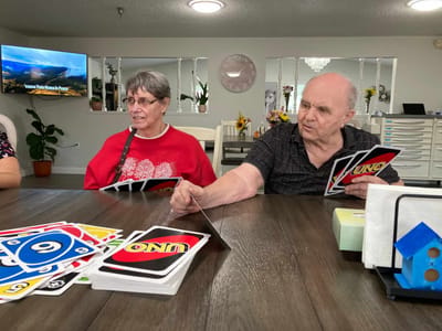 Residents playing Uno in a common area