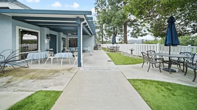 Outdoor seating area with tables and chairs