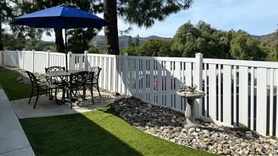 Outdoor patio area with seating and umbrella