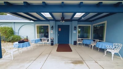 Outdoor seating area with tables and chairs