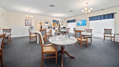Bright interior of a common area with tables and chairs