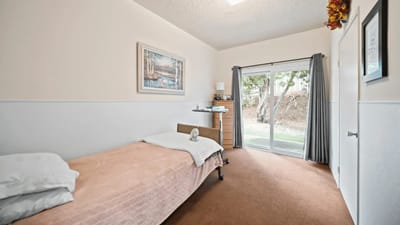 Bright, comfortable resident room with outdoor view