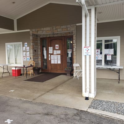Entrance of a senior living facility with signage