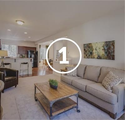 Bright interior living space with seating area and decor