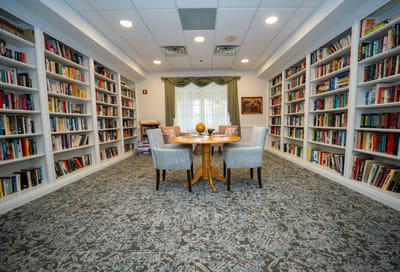 A cozy reading area with bookshelves and tables