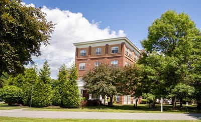 Exterior view of Wingate Residences surrounded by greenery
