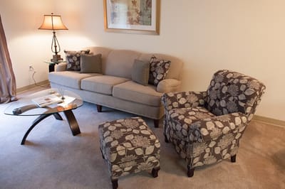 Cozy living room with seating and lamp