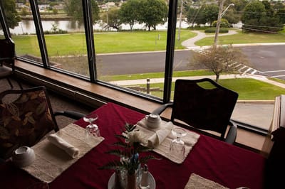 Dining area with a view of a landscaped outdoor space