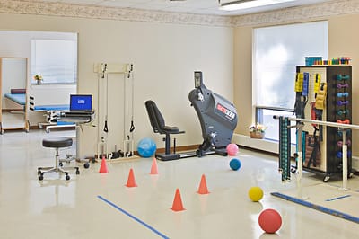 Interior view of a rehabilitation gym with exercise equipment