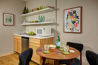 Cozy kitchenette area with dining setup and snacks
