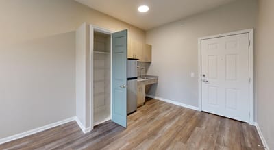 Interior view of a resident room with kitchenette