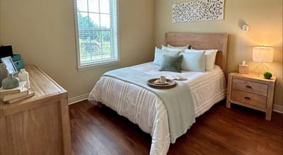 Cozy resident bedroom with natural light