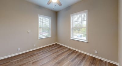 Empty resident room with two windows