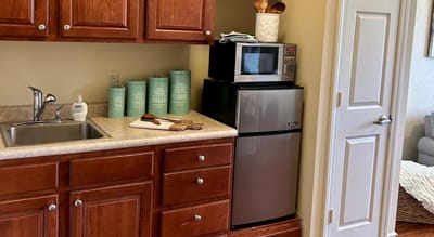 Compact kitchenette area in a resident's suite