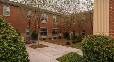 Outdoor courtyard area with benches and trees