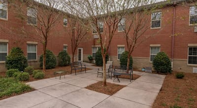 Outdoor courtyard with benches and trees